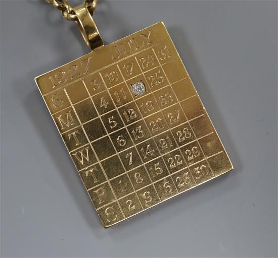 A 9ct gold 1927 calendar/identity pendant set with a single diamond on 9ct gold suspension chain, gross 42 grams